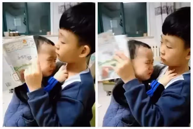 3歲弟弟被爸爸教訓，委屈鉆進7歲哥哥懷里告狀「爸爸又訓我」，哥哥暖舉感動大批網友：看完想生二胎了
