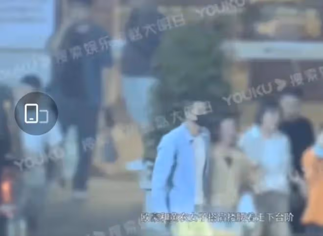 歐豪與女子搭肩摟腰過馬路，女方長發體型微胖，網友：他喜歡短髮