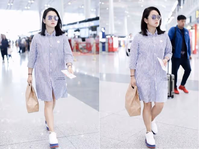 何潔的身材總讓人猜不透，穿襯衫裙小腿還挺細，感覺也不怎麼胖