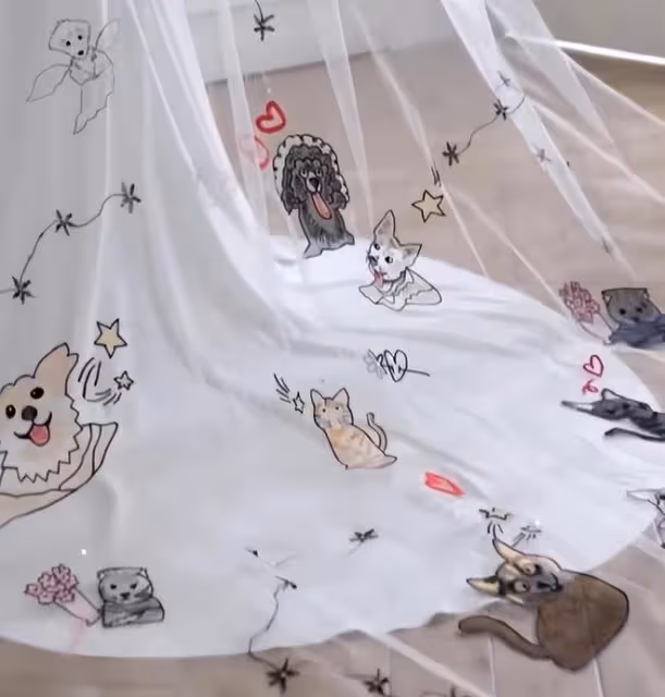 林有慧在婚紗上繡了13隻寵物貓狗,和蕭敬騰是一對精神契合型夫妻