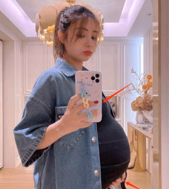 麥迪娜挺9個月巨肚拍照!肚子太大用手托住,孕期大膽化妝塗指甲