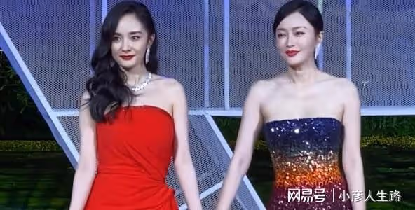 楊冪電影節身穿大紅禮裙,盡顯雪白肌膚,掀起裙擺卻露出黑色褲子