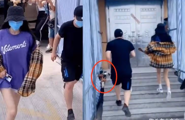 楊冪拍戲引發路人圍觀,穿兩萬黑短裙秀長腿,粉絲大膽爬樹拍照