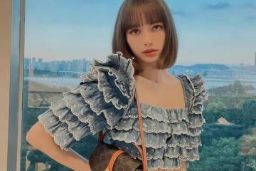 Lisa放棄「鐵劉海」，穿粉色上衣抱貓咪拍照，被嘲顏值下降造型土