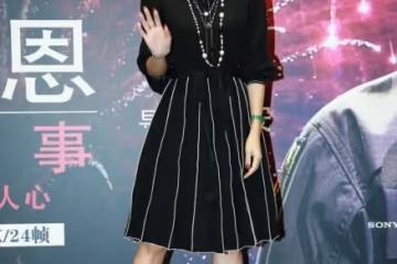 章子怡穿著襯衫裙的樣子太美了，雖然是黑色的，但卻一點也不單調